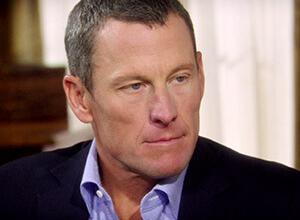 Lance Armstrong returns the Olympic medal