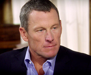 Lance Armstrong returns the Olympic medal