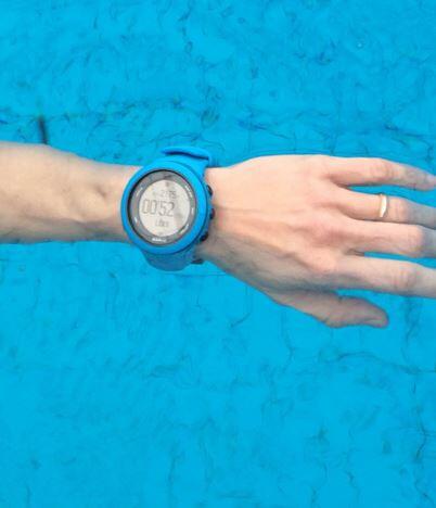 Chronometer watch in the hand of a triathlete