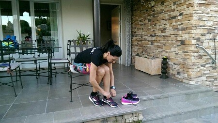 Monica tying her skechers shoes