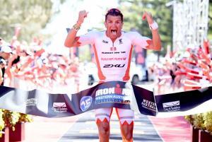 Terenzo Bozzone wins the Ironman Australia down from 8 hours and qualifies for Kona