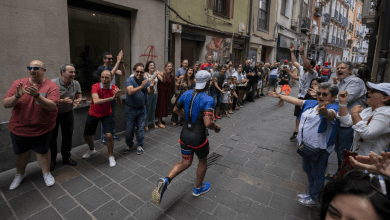 a triathlete passing through the streets of Vitoria