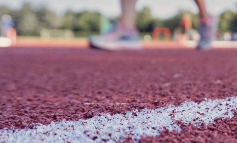 Athlete training on running track