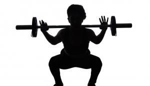 Boy lifting weights