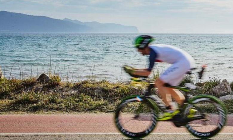 A triathlete in the cycling segment of IROMAN Mallorca