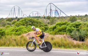 A triathlete with Port Aventure in the background