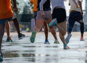 Athletes running with Hoka shoes