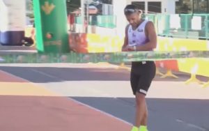 An athlete remains standing at the finish line so as not to break the record for a half marathon