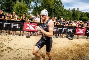 image of a triathlete coming out of the water