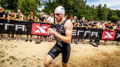 image of a triathlete coming out of the water