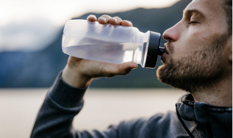 image of a sportsman drinking in winter