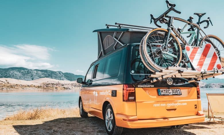 A roadsurfer van with bikes