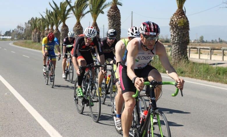 Triathletes in the cycling segment in Deltebre