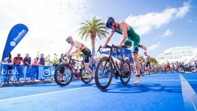image of 2 triathletes making a transition