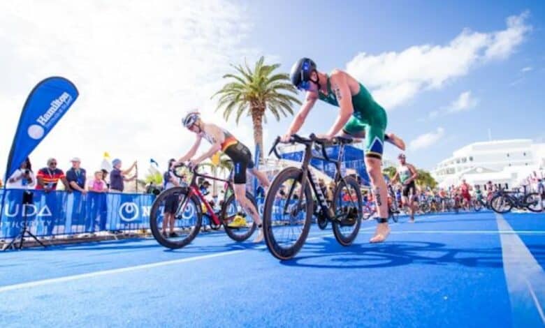 image of 2 triathletes making a transition