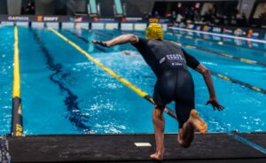 SLT/ image of a triathlete about to swim at the Arena Games