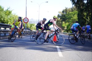 Triathletes in the Seville Triathlon cycling
