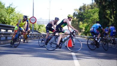 Triathletes in the Seville Triathlon cycling