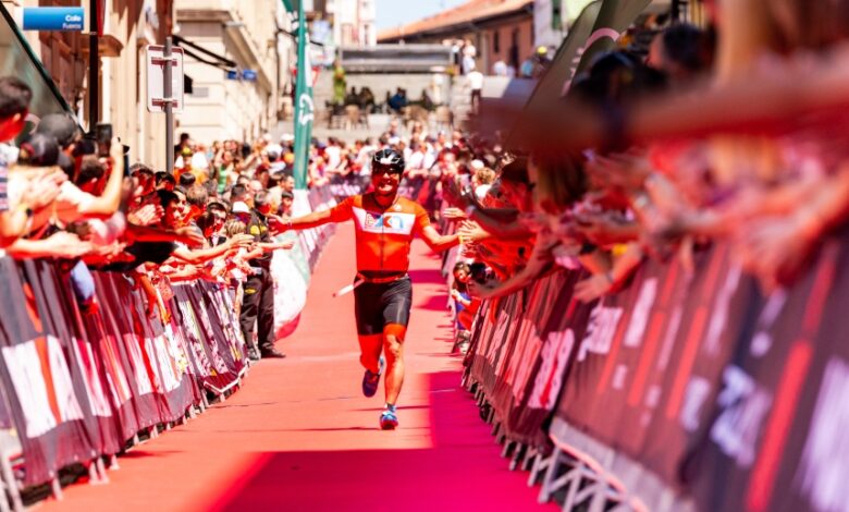 IRONMAN / Bild eines Triathleten, der die Ziellinie von IM Vitoria betritt