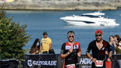 IRONMAN/ 2 triathletes running in the IRONMAN Portugal