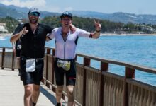 IRONMAN/2 triathletes running in a competition