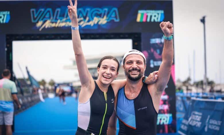 Two triathletes at the Valencia MTRI finish line
