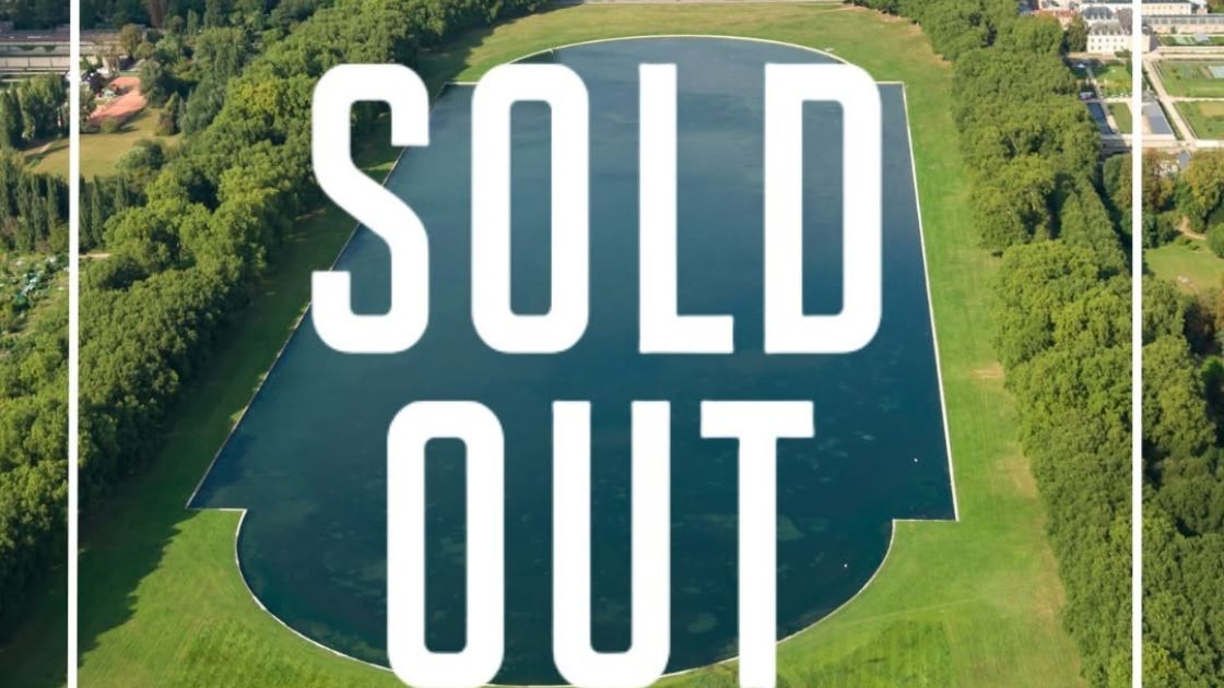 IRONMAN 70.3 Versalles 2026 sold out sobre imagen aérea del lago en Versalles