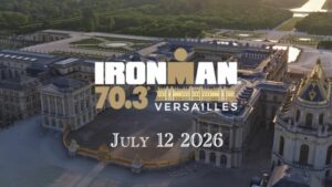 Vista aérea del Palacio de Versalles con el logotipo del IRONMAN 70.3 Versailles 2026